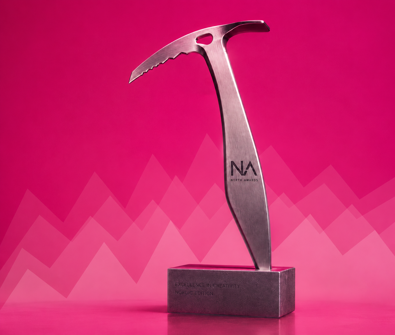 North Award trophy, a brushed steel ice axe mounted on a granite base